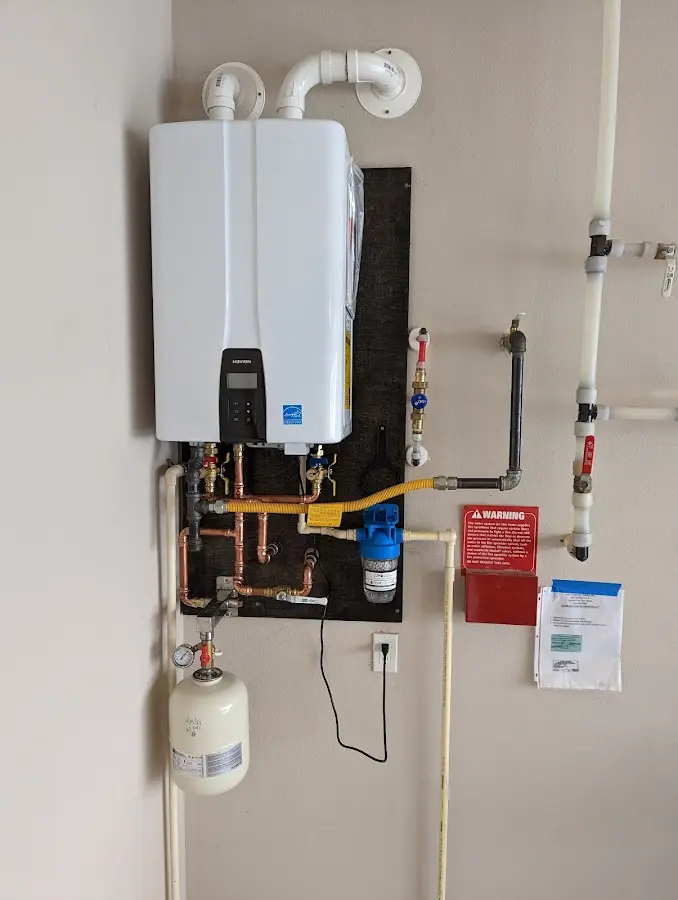 Professional plumber installing copper piping in a South Bound Brook home